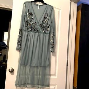Light blue with flowers. Transparent sleeves